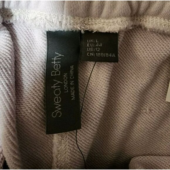 Sweaty Betty NWT Women's Revive Tie Waist Knit Shorts Lilac Size 12 - Picture 4 of 7